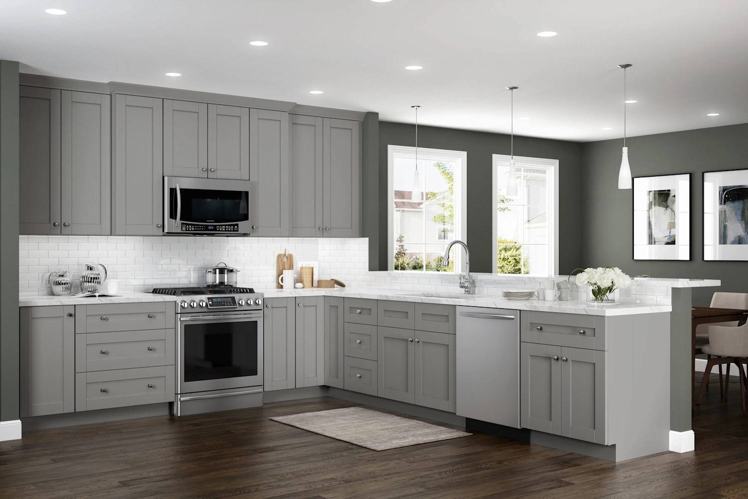 A small kitchen design using a monochromatic white and light gray color palette to maximize visual space