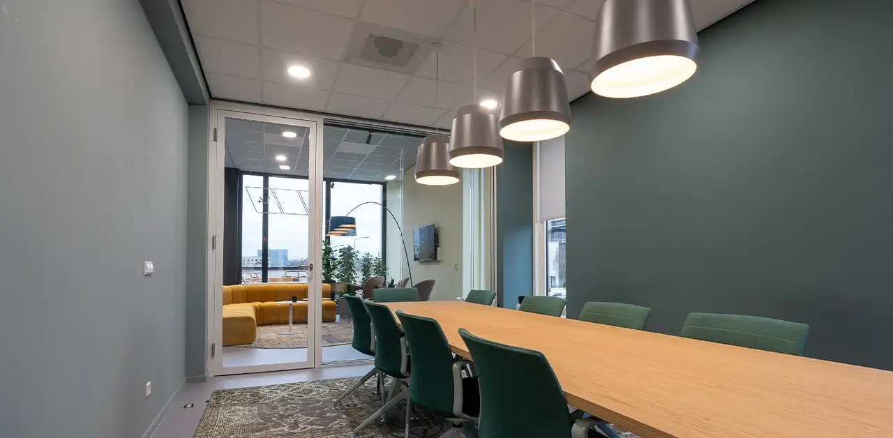 A well-lit home office space being assessed for functionality, showing available desk space and natural light.