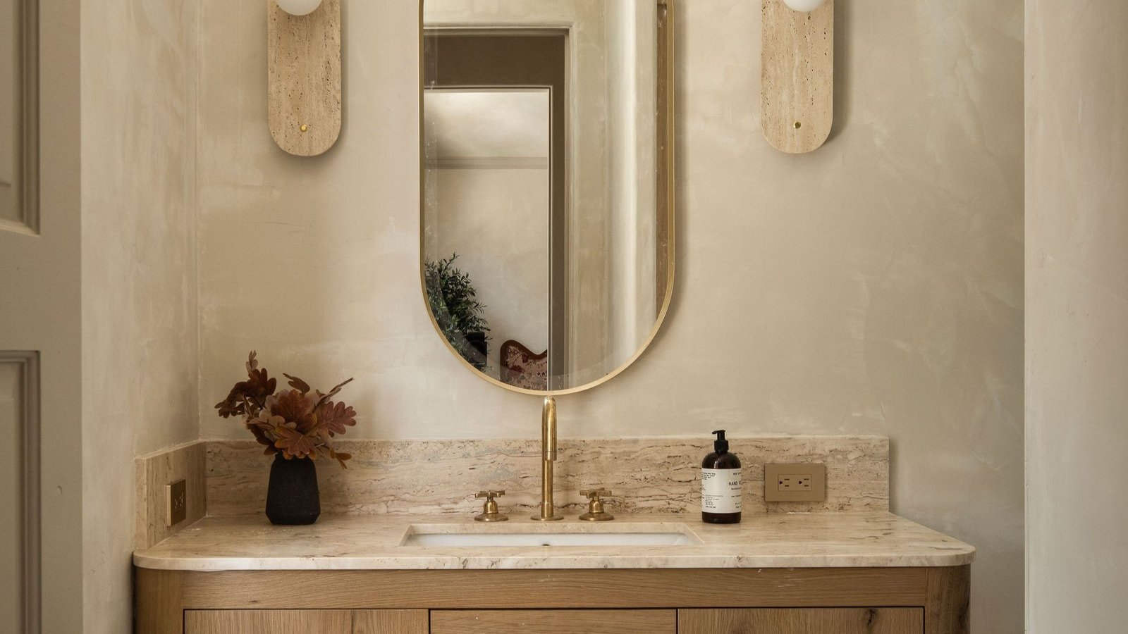 A modern bathroom remodel with a budget-friendly design, featuring a sleek vanity and neutral tones.