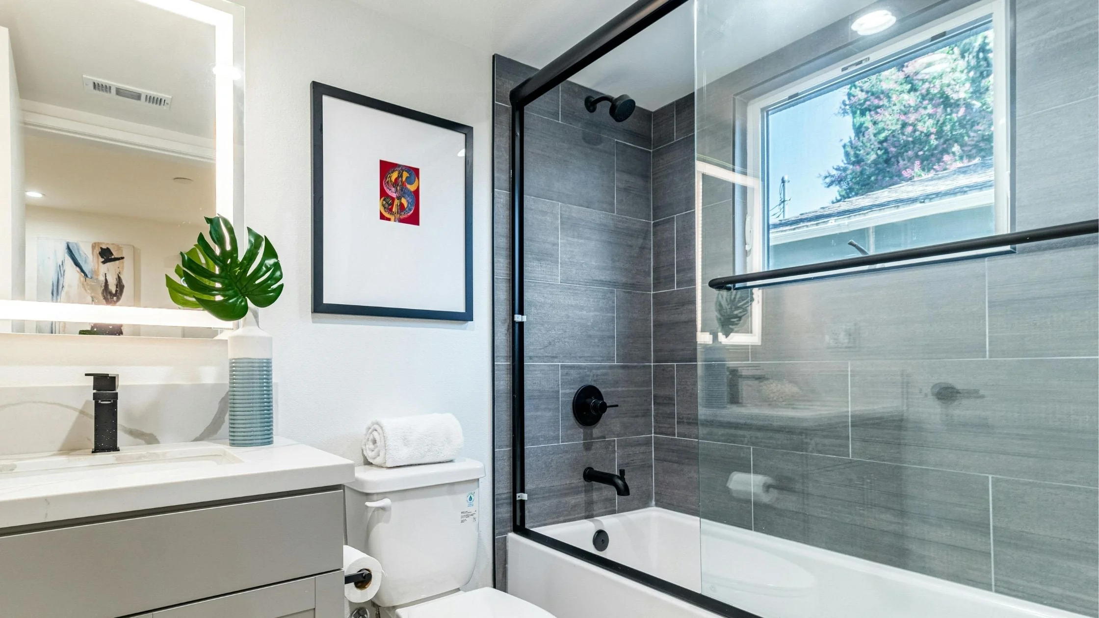 A completed budget bathroom remodel, with stylish design and affordable materials.