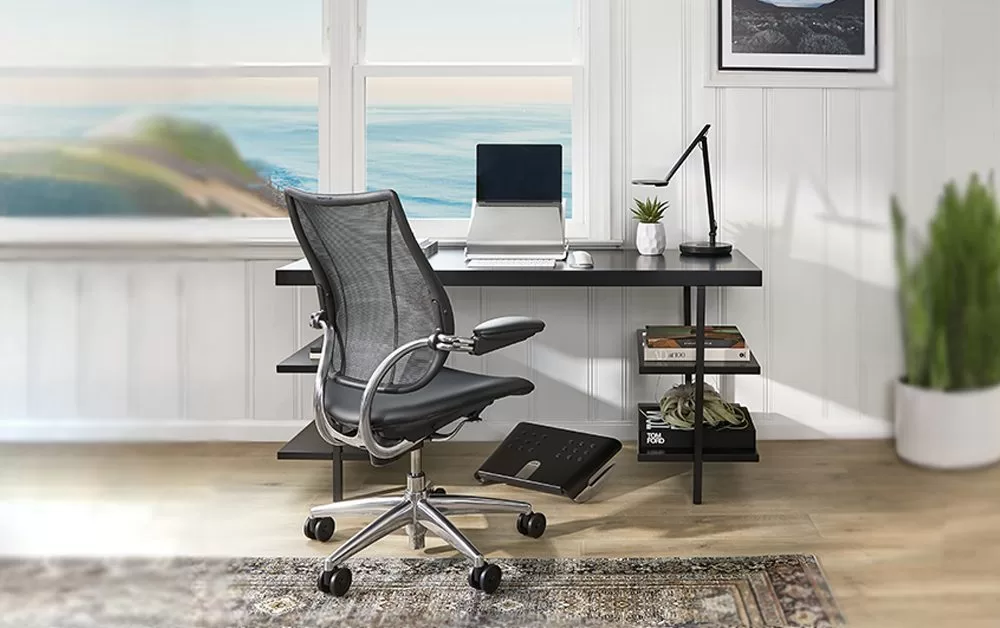 A stylish ergonomic chair in a DIY home office setup.