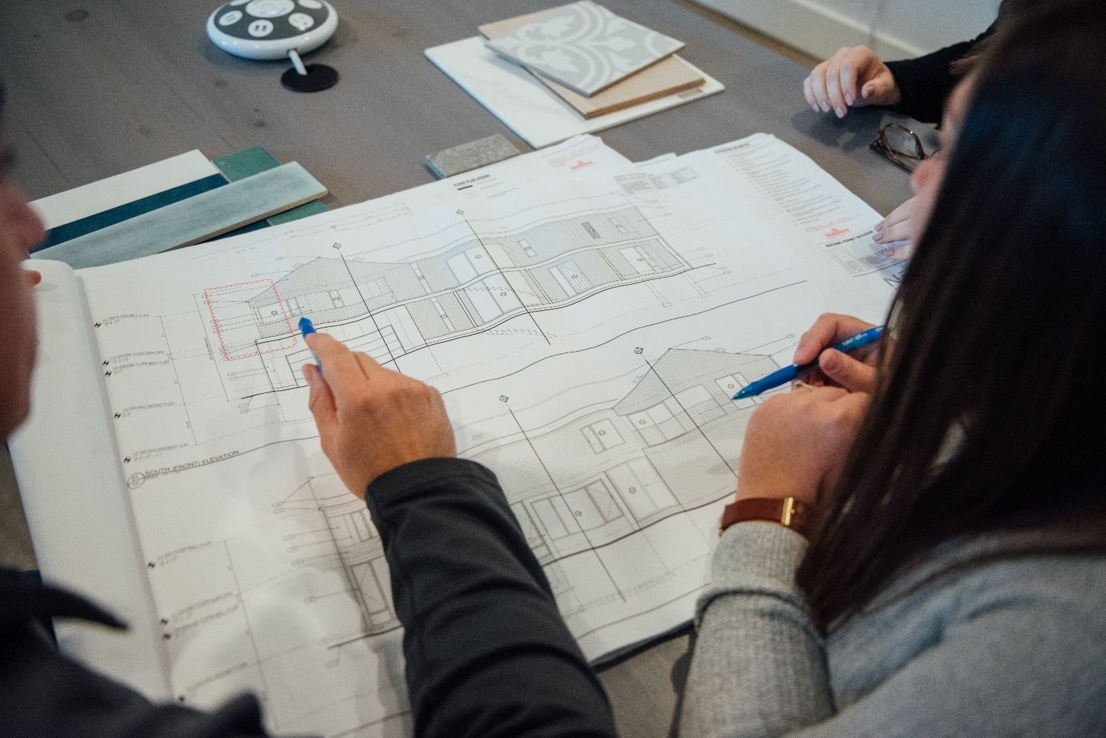 Home renovation contractor explaining project estimate to homeowner