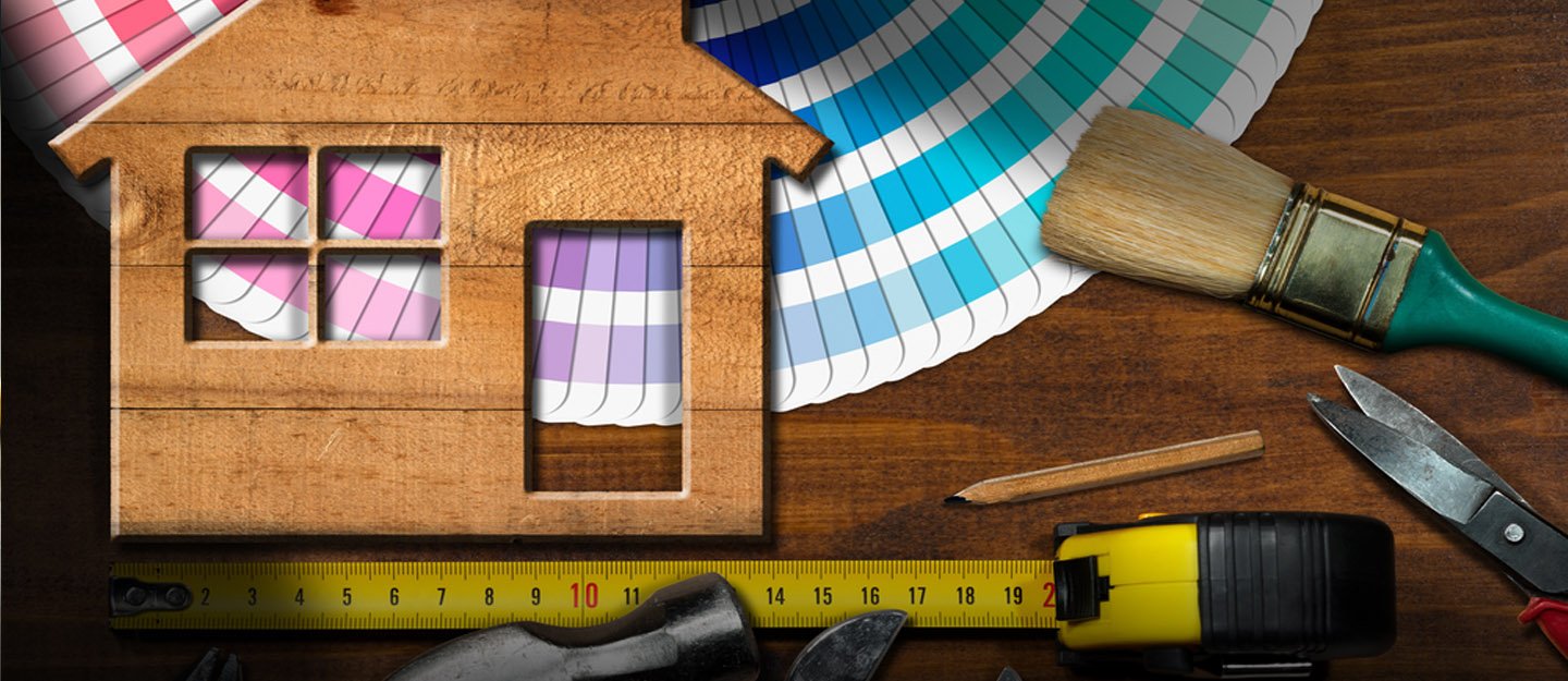 Weekend home improvement projects with paint brushes and tools on table