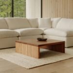 A modern living room featuring a coffee table made from sustainable materials like reclaimed wood