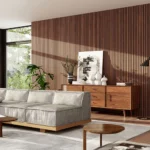 A modern living room with a slatted wood accent walls behind the sofa for added texture